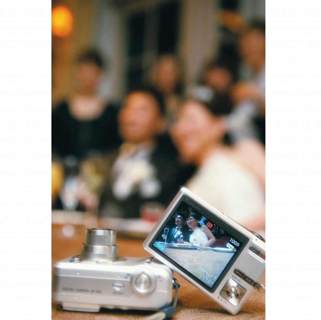 写真係